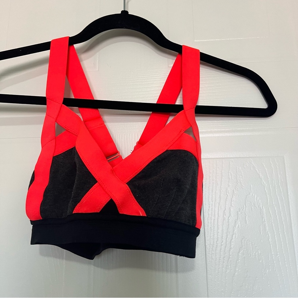 TNA Black and Orange Sports Bra for Intense Workouts